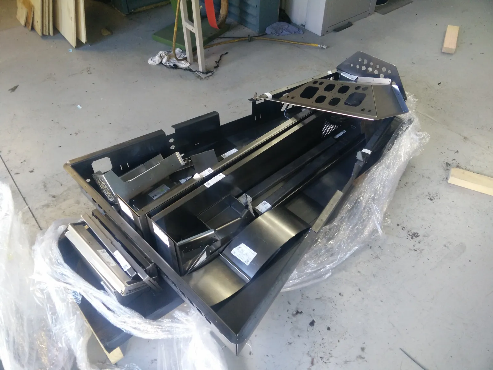 Laser-cut and folded cabinet parts fresh from the fabricator