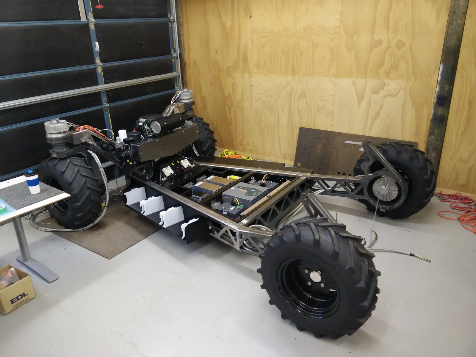 The platform in the workshop with the cabinet installed and power electronics mounted